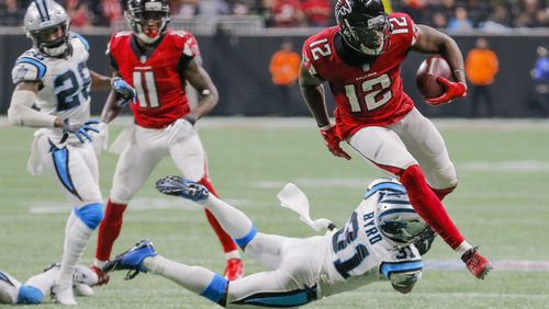 Carolina Panthers defensive back Jairus Byrd (31) looks to tackle Atlanta Falcons wide receiver Mohamed Sanu (12) during the second half of the game at Mercedes Benz Stadium, Sunday, December 31, 2017. Although the ball was caught in the end zone, the play was not ruled a touchdown. ALYSSA POINTER/ALYSSA.POINTER@AJC.COM