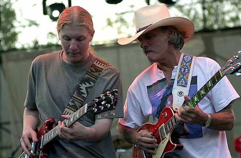 Derek Trucks, left, and Dickey Betts jam together with The Allman Brothers Band at the Music Midtown festival in 2000. Ben Gray/AJC staff
