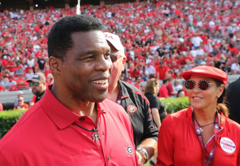 Herschel Walker, seen her with his wife Julie, has been spotted recently back on the campus of the University of Georgia.