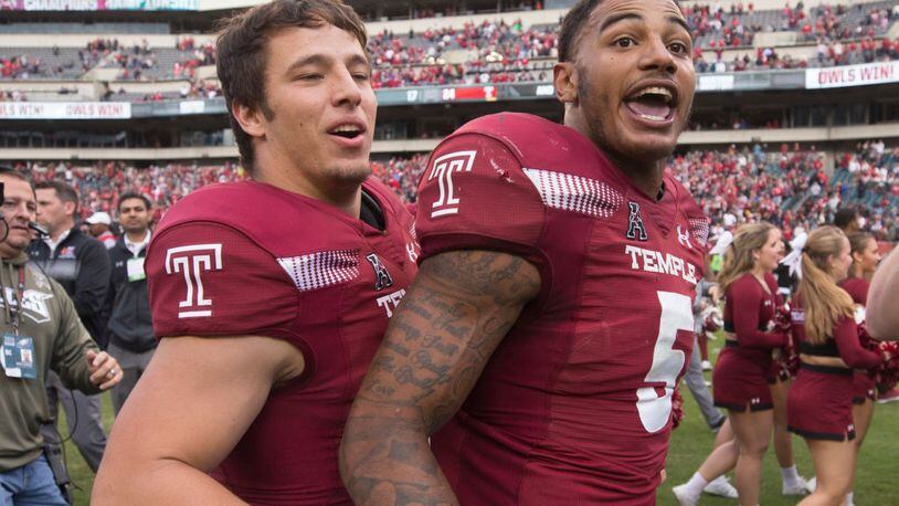 Kevin DeCaesar and Shaun Bradley of the Temple Owls celebrate after the game against the Cincinnati Bearcats at Lincoln Financial Field on October 20, 2018 in Philadelphia, Pennsylvania. The Temple Owls defeated the Cincinnati Bearcats 24-17 in overtime. (Photo by Mitchell Leff/Getty Images)