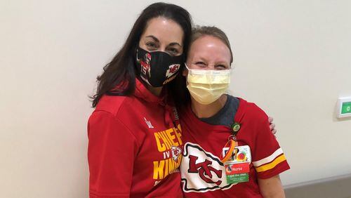 All dressed up for the big game: Fellow workers at the Children's Healthcare of Atlanta's Aflac Cancer and Blood Disorders Center Andrea Nowlin (L) and Dori Longley will be treated to Sunday's Super Bowl. As a show of appreciation, NFL teams are hosting 7,500 health-care workers. (Photo courtesy Children's Healthcare)