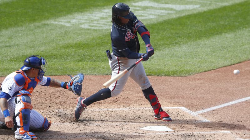 Braves outfielder Ronald Acuna hits a home run against the New York Mets during the sixth inning Sunday, Sept. 20, 2020, in New York. (Noah K. Murray/AP)