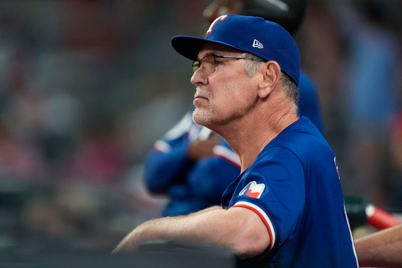 Texas Rangers manager Bruce Bochy looks on from the dugout during a baseball game against the Atlanta Braves Saturday, April 20, 2024, in Atlanta. (AP Photo/John Bazemore)