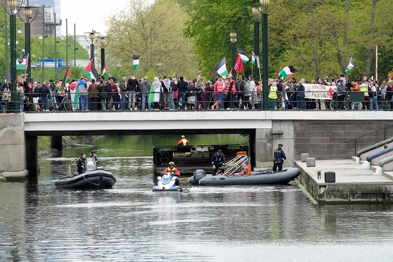 Police stand by next to a bridge during a Pro-Palestinian demonstration for excluding Israel from Eurovision ahead of the second semi-final at the Eurovision Song Contest in Malmo, Sweden, Thursday, May 9, 2024. (AP Photo/Martin Meissner)