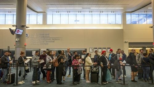 People wait in line at U.S. Customs and Border Protection at Hartsfield-Jackson Atlanta International Airport on May 2, 2018. ALYSSA POINTER/ALYSSA.POINTER@AJC.COM