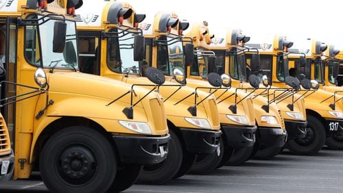 Buses are lining up to pick up students next week. Some Georgia schools resume Monday. (AJC File)