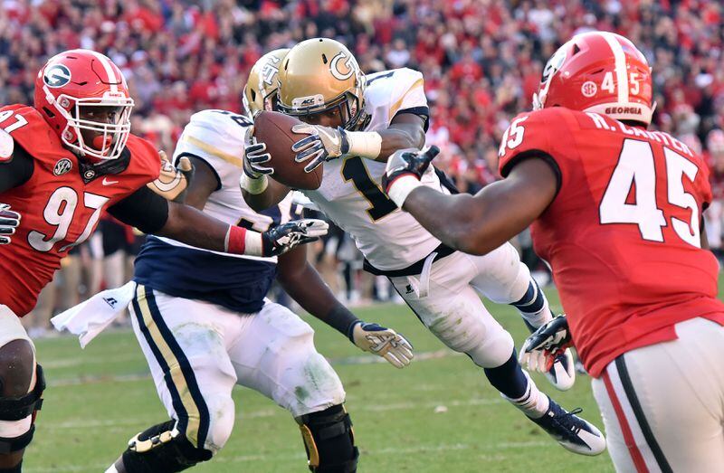 November 26, 2016 Athens - Georgia Tech running back Qua Searcy (1) leaps over for a game winning touchdown in the second half at Sanford Stadium on Saturday, November 26, 2016. Georgia Tech won 28-27 over the Georgia. HYOSUB SHIN / HSHIN@AJC.COM