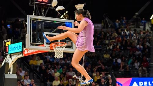 Rong Niu, better known to sports fans as "Red Panda," performed Sunday at McCamish Pavilion at halftime of the Georgia Tech-Duke game. She has been using a unicycle made parts scavenged from three old unicycles after her primary unicycle was stolen.