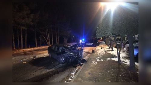 A crash on black ice sent a Fulton County police officer  and another driver to the hospital Friday.