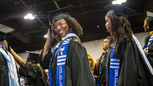Lexington Jackson make her way to her seat during Spelman College’s 137th commencement at the Georgia International Convention Center on Sunday, May 19, 2024. Angela Bassett, the keynote speaker, and Supreme Court Justice Ketanji Brown Jackson were both awarded honorary degrees.  (Jenni Girtman for The Atlanta Journal-Constitution)