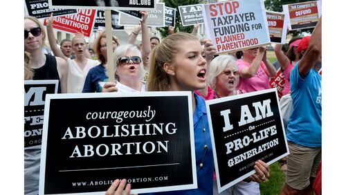 Anti-abortion activists hold a rally opposing federal funding for Planned Parenthood in front of the U.S. Capitol July 28, 2015 in Washington, D.C.