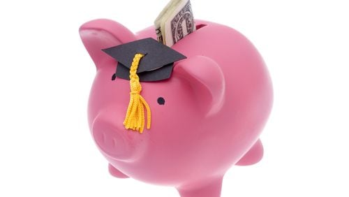Student loan, piggy bank with graduation cap.