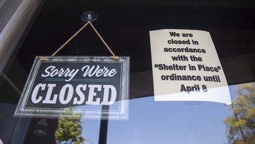 A closed sign is displayed on a storefront downtown Rome. Some businesses are suing their insurance carriers over covering their losses because of virus-reated closings. ALYSSA POINTER / ALYSSA.POINTER@AJC.COM