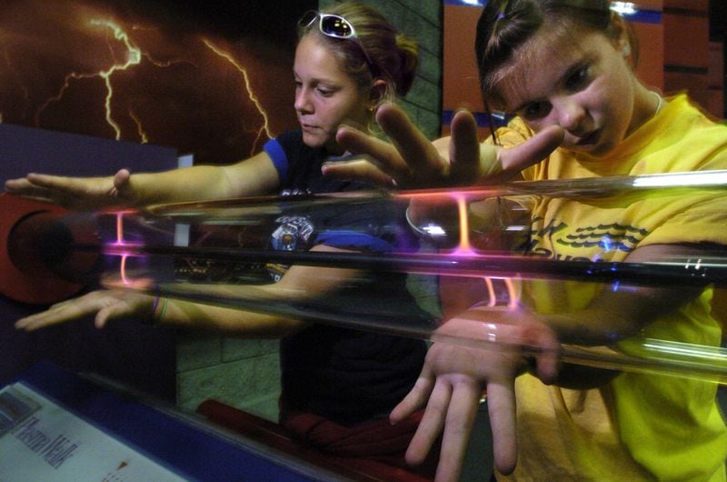 School field trips and birthday parties were commonplace in the 1990s at Atlanta’s SciTrek children’s science museum, which had exhibits like this electricity “plasma walk.” (AJC file photo)