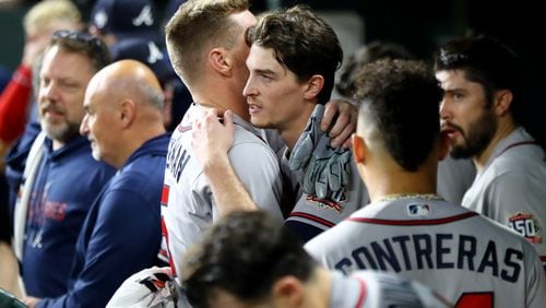 Braves first baseman Freddie Freeman, left, gives starting pitcher Max Fried, facing, a hug after Fried goes six scoreless innings against the Houston Astros in game 6 of the World Series at Minute Maid Park, Tuesday, November 2, 2021, in Houston, Tx. Curtis Compton / curtis.compton@ajc.com