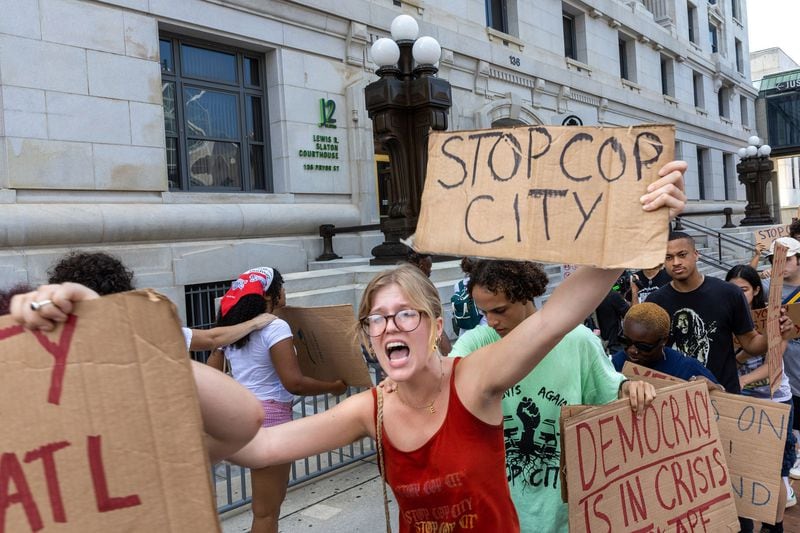 Protestors against Atlanta's planned public safety training center, known by some as "Cop City," gather at Fulton County Courthouse in Atlanta on Monday, Aug. 14, 2023. (Arvin Temkar/The Atlanta Journal-Constitution/TNS)