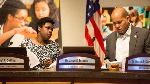The Atlanta school board vice chair Eshe’ Collins (left) and chairman Jason Esteves chat before a special meeting in September 2019. AJC file photo. (Photo by Phil Skinner)