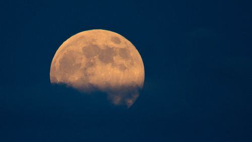 A super moon rises over the Boynton Beach Inlet in Boynton Beach, Florida on September 8, 2014. (Allen Eyestone / The Palm Beach Post)