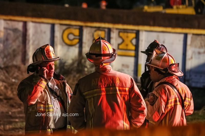 Atlanta firefighters responded Thursday morning after a train derailed and crashed into a house in northwest Atlanta. JOHN SPINK / JSPINK@AJC.COM