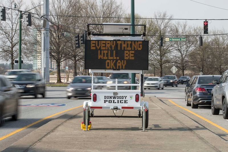 03/18/2020 -- Dunwoody, Georgia -- A Dunwoody Police electronic sign gives a hopeful message to drivers, near the intersection of Ashford-Dunwoody Road and Hammond Drive, in Dunwoody, Wednesday, March, 18, 2020. (ALYSSA POINTER/ALYSSA.POINTER@AJC.COM)