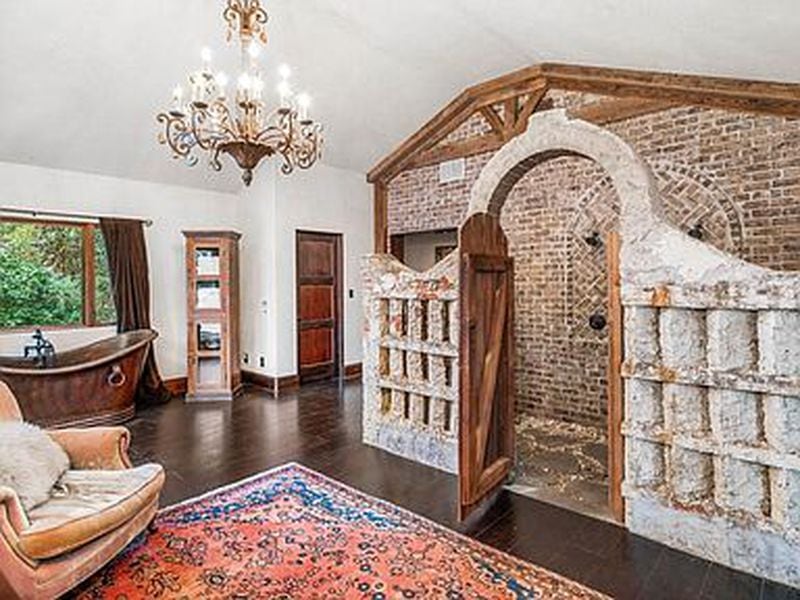The mansion includes a stone shower in the master bathroom that has attracted attention on Instagram.