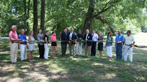 Forsyth County officials gathered for a ribbon-cutting opening Chattahoochee Pointe Park in June of 2012.