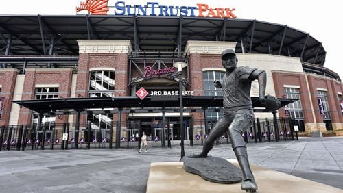 A statue of former Braves pitcher Phil Niekro stands before the third-base gate at SunTrust Park. (Hyosub Shin/hshin@ajc.com)