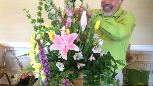 Florist K. Mike Whittle, shown giving a floral arrangement class, had cash stolen from his Marietta store. Photo: Jennifer Brett