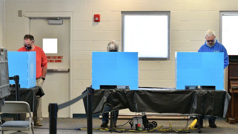 Gwinnett County residents cast their ballots at an early voting location in Mountain Park Activity Building in Stone Mountain on Saturday, October 22, 2022. (Hyosub Shin / Hyosub.Shin@ajc.com)