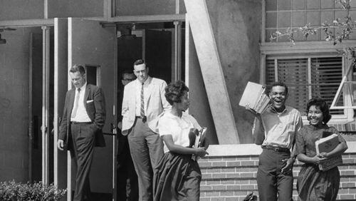 Willie Jean Black, Arthur Simmons and Donita Gaines leave Northside High School on the second day of class in 1961. The three were among nine Black Atlanta teens who integrated the Atlanta Public Schools that week in late August. Atlanta began integrating its schools seven years after the Supreme Court's Brown v Board decision. (Charles Pugh / AJC Archive at the GSU Library AJCP297-004b)