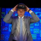 Football and fashion: North Carolina quarterback Drake Maye puts on a hat after being chosen by the New England Patriots with the third overall pick during the first round of the NFL football draft, Thursday, April 25, 2024, in Detroit. (AP Photo/Jeff Roberson)
