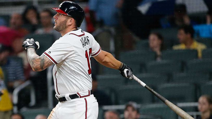 Matt Adams follows through on his two-run homer, his first as a Brave, in the fifth inning of Monday&#039;s game against the Pirates at SunTrust Park.