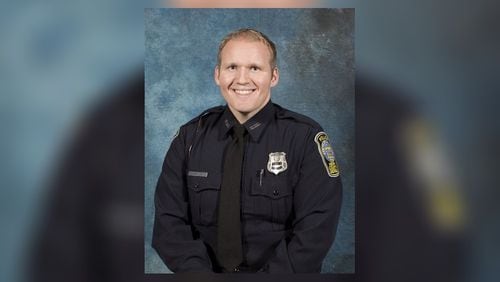 Henry County police Officer Michael Smith was shot Dec. 6 during a struggle with a man inside a dentist's office. He died of his injures Friday morning.