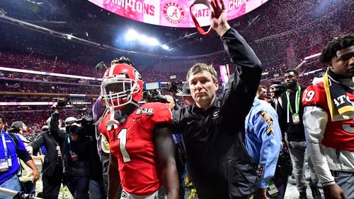 January 8, 2018 Atlanta - Georgia head coach Kirby Smart and running back Sony Michel (1) leave after Alabama defeated the Georgia during College Football Playoff National Championship at Mercedes-Benz Stadium on Monday, January 8, 2018. Alabama came back from a 13-point second half deficit after switching to the young quarterback in a dramatic 26-23 overtime victory over Georgia in the college football title game Monday night at Mercedes-Benz Stadium. HYOSUB SHIN / HSHIN@AJC.COM