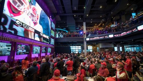 Georgia fans during a watch party at Sports & Social restaurant before Georgia plays Oklahoma in the Rose Bowl in Pasadena, Jan. 1, 2018, in Atlanta. After the win, people went bananas.