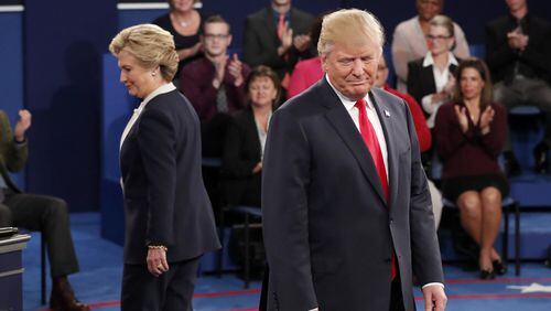 Democratic presidential nominee Hillary Clinton, left, and Republican presidential nominee Donald Trump arrive before the second presidential debate at Washington University in St. Louis, Sunday, Oct. 9, 2016. (Rick T. Wilking/Pool via AP)