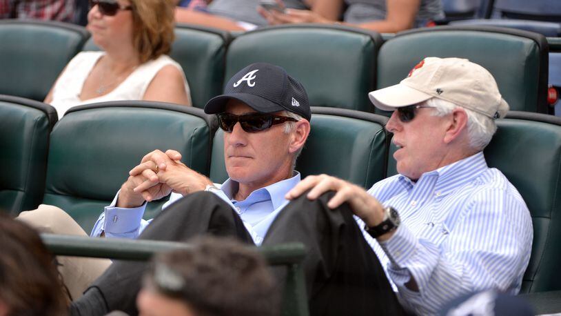 Liberty Media CEO Greg Maffei (left) and Braves Chairman Terry McGuirk talk during a Braves game in 2016 at Turner Field. (File photo by HYOSUB SHIN / HSHIN@AJC.COM)