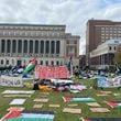 At Columbia University in New York, protesters erected signs on the newly occupied South Lawn, which stood throughout Thursday night and Friday. (Alice Tecotzky for The Atlanta Journal-Constitution)