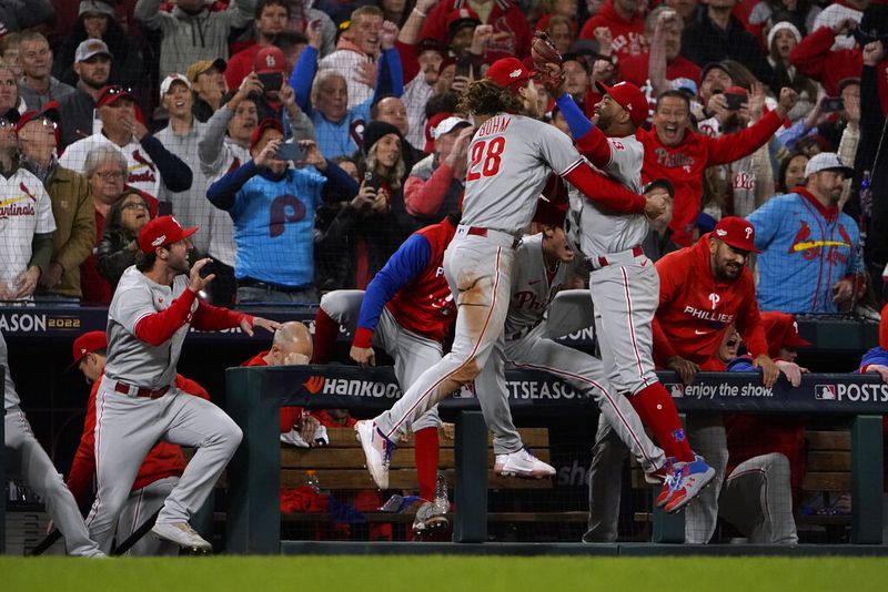 The Philadelphia Phillies celebrate after defeating the St. Louis Cardinals 2-0 in Game 2 of an NL wild-card baseball playoff series Saturday, Oct. 8, 2022, in St. Louis. The Phillies advanced to the NL Division Series against the Atlanta Braves. (AP Photo/Jeff Roberson)