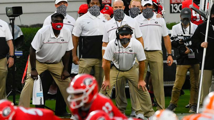 Georgia head coach Kirby Smart bends and watches the offense in red zone during the second half of a football game against Tennessee on Saturday, Oct. 10, 2020, at Sanford Stadium in Athens. Georgia won 44-21. JOHN AMIS FOR THE ATLANTA JOURNAL- CONSTITUTION