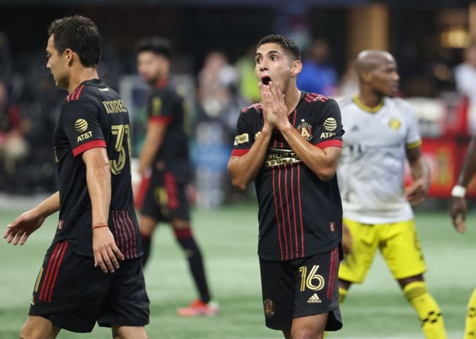 Atlanta United forward Erik Lopez (16) and forward Erick Torres (31) react after a missed scoring opportunity. JASON GETZ FOR THE ATLANTA JOURNAL-CONSTITUTION