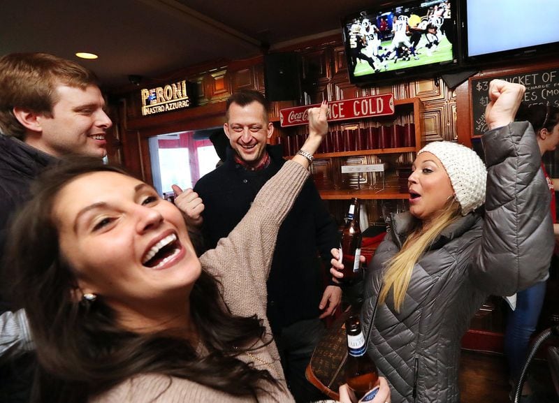 Falcons fans Ryan Montgomery (from left), Tiffany McCoy, Timothy Kotoski and Raegan McCoy cheer as the Rams score against the Saints while watching the NFC Championship game at Elbow Room Sports Pub & Pizzeria on Sunday, Jan. 20, 2019, in Atlanta. The Rams went on to defeat the Falcons’ dreaded rivals from New Orleans. (Photo: Curtis Compton/ccompton@ajc.com)