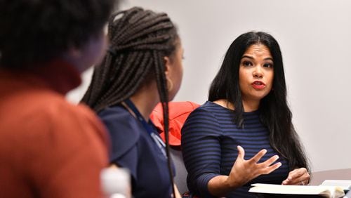 Dr. Natalie Hernandez, executive director, leads a meeting with her staff at Morehouse School of Medicine’s Center for Maternal Health Equity, Wednesday, Jan. 25, 2023, in Atlanta. (Hyosub Shin / Hyosub.Shin@ajc.com)