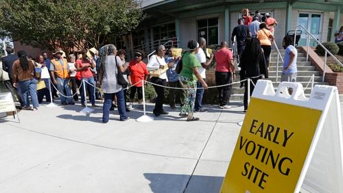 FILE - In this Oct. 20, 2016 file photo ,voters line up during early voting at Chavis Community Center in Raleigh, N.C. More than a dozen states have enacted tougher requirements for registering and voting since the U.S. Supreme Court overturned a key provision of the Voting Rights Act three years ago. That has led to confusion and claims that certain groups, mostly minorities who tend to vote with Democrats, are being disenfranchised. (AP Photo/Gerry Broome, File)
