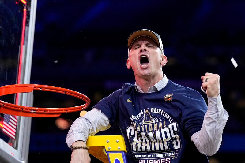 UConn head coach Dan Hurley celebrates cutting the net after the NCAA college Final Four championship basketball game against Purdue, Monday, April 8, 2024, in Glendale, Ariz. (AP Photo/Brynn Anderson)