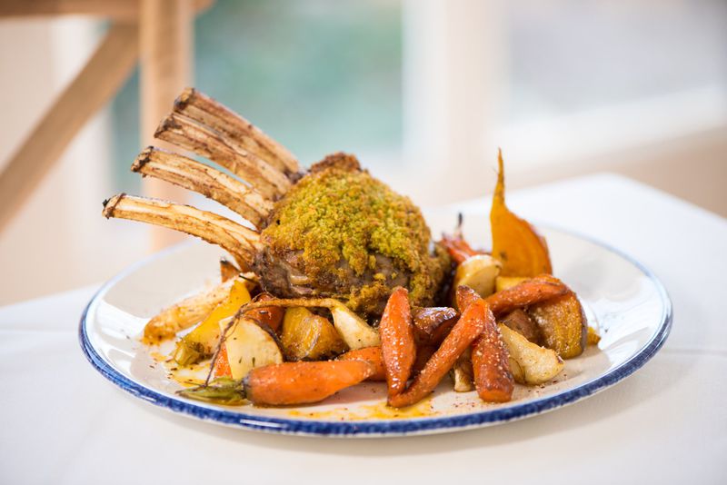 The Farmhouse at Serenbe Parsley Crusted Lamb Racks With Roasted Root Vegetables. CONTRIBUTED BY MIA YAKEL