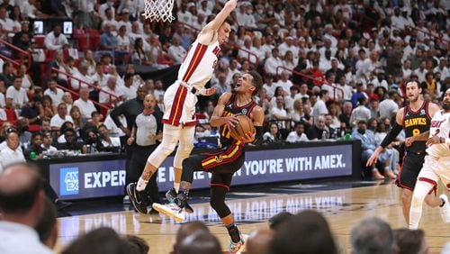 Miami Heat guard Tyler Herro blocks Atlanta Falcons guard Trae Young during the first half of Game One of the first-round playoff series against at FTX Arena on Sunday, April 17, 2022, in Miami. (John McCall/South Florida Sun Sentinel/TNS)