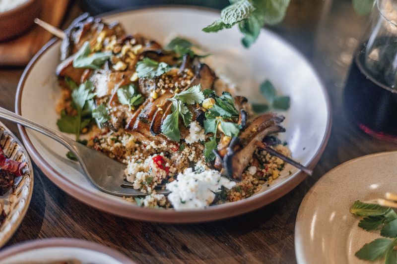 The mushroom shawarma with umami glaze and pistachio dukkah is a vegetarian skewer option at Ela. Courtesy of Frankie Cole