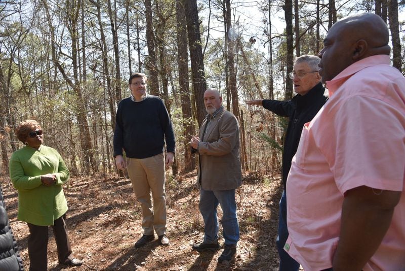 (From left) Bobbie Hart, Wesley Edwards, Michael Bowen, Gene Bowen and Mike Merideth visit the Troup County site where Austin Callaway was found bleeding to death from gunshot wounds in 1940 and taken to a hospital. Their organization, Troup Together, has been researching Callaway’s lynching and working to promote racial dialogue in the county. HYOSUB SHIN / HSHIN@AJC.COM