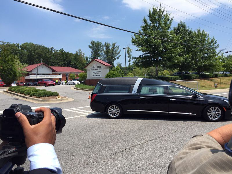 Bobbi Kristina's hearse pulling out of St. James United Methodist Church at about 2 p.m. Saturday, August 1, 2015. CREDIT: Rodney Ho/rho@ajc.com
